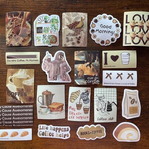 May include: A collection of twenty-one rectangular and die-cut stickers featuring coffee-themed illustrations, including cups, coffee beans, pastries, and text such as Good Morning, I'm 99% Coffee, 1% Human, More Espresso Less Depresso, and Coffee Club.