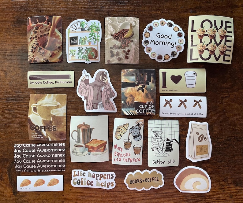 May include: A collection of twenty-one rectangular and die-cut stickers featuring coffee-themed illustrations, including cups, coffee beans, pastries, and text such as Good Morning, I'm 99% Coffee, 1% Human, More Espresso Less Depresso, and Coffee Club.
