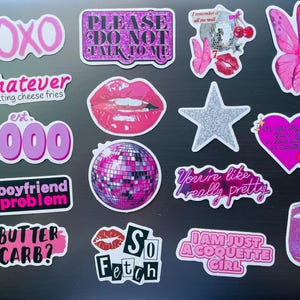 May include: A collection of pink and white stickers with various designs and text, including phrases like "XOXO," "Whatever," and "So Fetch." Other stickers feature a disco ball, lips, and a butterfly.