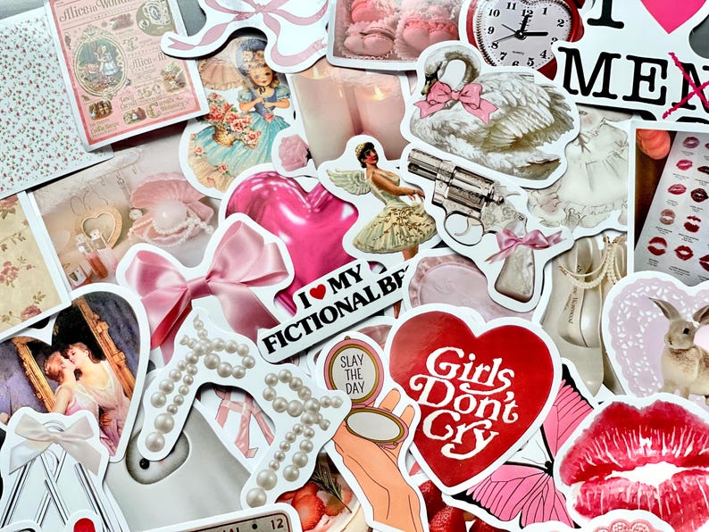 May include: A collection of colorful stickers featuring various designs, including a pink heart with a bow, a swan, a heart with the text "I love my fictional bf", a heart with the text "Girls Don't Cry", a butterfly, and a red lip. The stickers are perfect for adding a touch of whimsy and personality to journals, laptops, water bottles, and other surfaces.