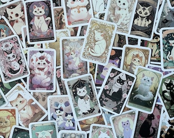 May include: A collection of colorful cat tarot cards with various cat illustrations and card names like "The World", "The High Priestess", "Ace of Wands", and "Two of Swords".
