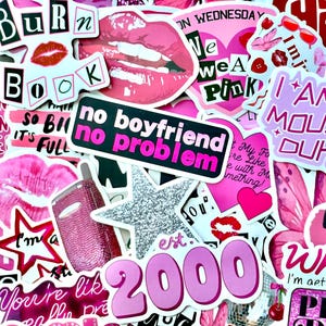May include: A collection of pink stickers with various designs and text. The stickers include phrases like "no boyfriend no problem," "Burn Book," and "I am a mouse duh!" Other designs include lips, hearts, and a glittery star.