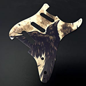 Premium Metal Stratocaster Pickguard w/ &quot;Raven&#39;s Wake&quot; UV print | Sealed w/ your choice of Cerakote or Polyurethane | Made in America