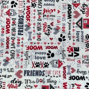 May include: White fabric with a repeating pattern of red and black text and paw prints. The text includes phrases like "Dog Hair Don't Care", "Friends Fur-Ever", "It's a Dog Thing", "Woof", and "Live Love Woof".