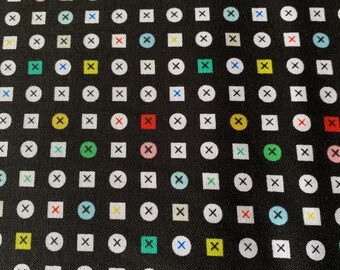 May include: Black fabric with a repeating pattern of white circles and squares, each containing a white 'X'. The circles and squares are interspersed with colorful accents of red, yellow, green, and blue.