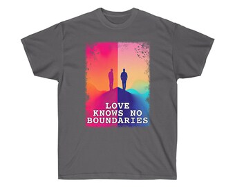 May include: A dark gray t-shirt with a colorful graphic of two figures standing on a hill. The text "LOVE KNOWS NO BOUNDARIES" is printed below the graphic.