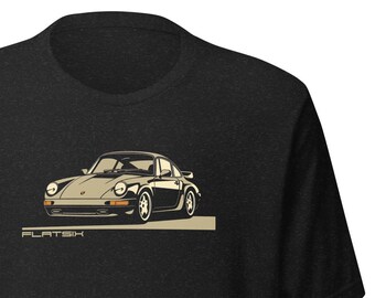 May include: A black t-shirt with a graphic of a vintage Porsche 911 car in beige and brown. The text "FLAT6" is printed below the car.