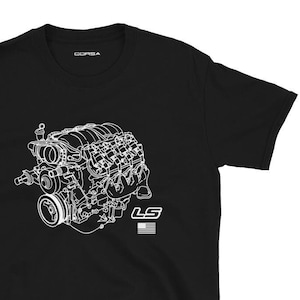 May include: Black t-shirt with a white outline of an LS engine and the text "LS" with a small American flag.