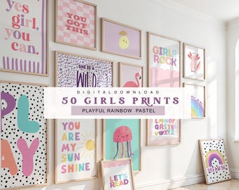 May include: A collection of framed art prints with playful designs and pastel colors. The prints feature phrases like "Yes Girl, You Can" and "You Got This," along with illustrations of a sun, a rainbow, and a jellyfish. The text "50 Girls Prints" is also visible.