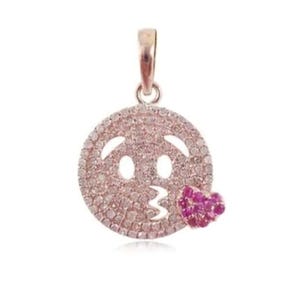 May include: A rose gold pendant in the shape of a kissing face emoji. The emoji is encrusted with small, clear stones, with a cluster of pink stones forming the heart-shaped kiss.