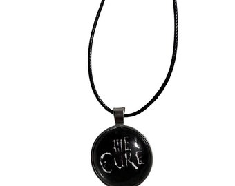 the cure logo pendant necklace