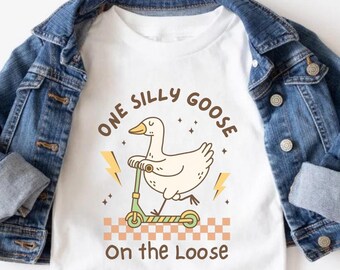 Eine verrückte Gans auf dem losen ersten Geburtstags-Jungen-Mädchen-Shirt, eine verrückte lose Gans zum 1