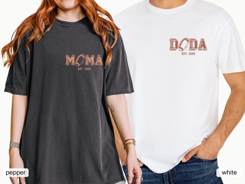 May include: Two t-shirts, one black and one white, with a football graphic and text. The black shirt says "MOMA EST. 2025" and the white shirt says "DODA EST. 2025".