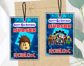 May include: Two rectangular gift tags with black and white checkered borders, featuring a blue digital background, the text Happy 6th Birthday, the name Hudson, and the Roblox logo. One tag shows a character head, the other shows a group of characters.