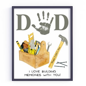 May include: A Father's Day printable with a handprint and the word "DAD" in gray. The image also includes a toolbox with tools and the text "Happy Father's Day" on a hammer. The text at the bottom reads "I love building memories with you!"
