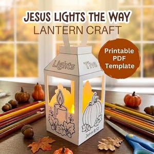 May include: A white paper lantern craft featuring the text JESUS LIGHTS THE WAY LANTERN CRAFT and Printable PDF Template. The lantern has black line art of a candle, pumpkin, and leaves with the text Lights The and John 8:12 printed on it.