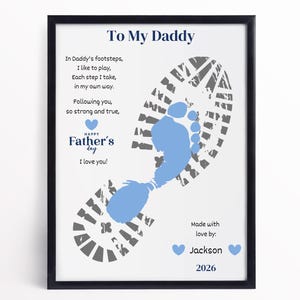 May include: Framed Father's Day print with a blue footprint design and the text "To My Daddy." The print includes a poem and the words "Happy Father's Day." The print is personalized with a name and year.