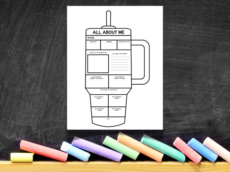 May include: Black and white "All About Me" printable worksheet in the shape of a mug. The worksheet includes sections for name, birthday, hobbies, a picture, and more. Colorful chalk sticks are at the bottom.
