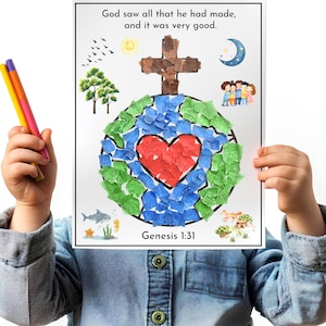 May include: A colorful artwork featuring a paper mosaic of the Earth with a red heart, blue and green continents, and a brown cross. The text "God saw all that he had made, and it was very good. Genesis 1:31" is printed at the top and bottom.