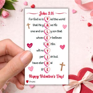 以下が含まれることがあります： 「ヨハネによる福音書 3:16」のテキストと愛と信仰に関するメッセージが書かれたバレンタインデーカード。ハート型の風船、ハート、十字架が描かれています。「VALENTINE」の文字が強調されています。「ハッピーバレンタインデー！」というフレーズも含まれています。