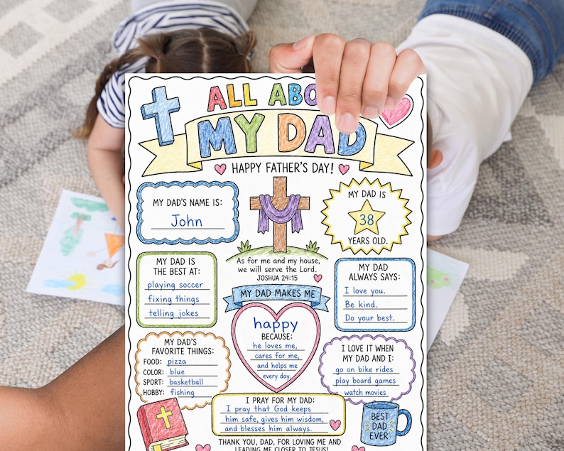 May include: A Father's Day colouring page with the title "All About My Dad." The page has spaces to fill in information about the dad, including his name, age, favourite things, and what he always says. The page is held by a person.