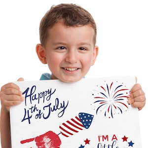 May include: A young boy holds a sign that says "Happy 4th of July" with a red, white and blue firework graphic. The sign also has a red handprint and a firework graphic with the text "I'm a little firecracker".