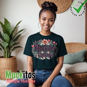 May include: A woman wearing a dark teal t-shirt with a floral design and the text "Mockitos Mockups".