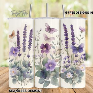 May include: Three stainless steel tumblers with floral and butterfly designs. The tumblers feature lavender, purple flowers, and butterflies on a cream background. The text "6 FREE DESIGNS INCLUDED!" is visible.