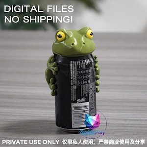 May include: A green frog-shaped topper with yellow eyes designed to fit over the top of a black soda can. The frog has detailed limbs that wrap around the sides of the can. The text DIGITAL FILES NO SHIPPING! is visible at the top of the image.