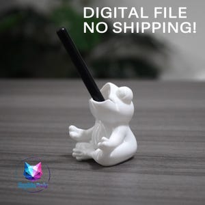 May include: A white frog-shaped figurine in a seated position with a black stylus inserted into its open mouth. The text DIGITAL FILE NO SHIPPING! is visible at the top, and a colorful geometric cat logo with the text Sophie Poly is at the bottom.