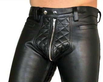 May include: Black leather pants with a quilted design. The pants have a zipper down the front and a belt with metal buttons.