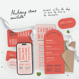 May include: A set of wedding stationery in coral and pink with a save the date card, a thank you card, a wedding menu, and a table number card. The save the date card is shaped like a smartphone and features the text "Save the Date" in a retro font. The wedding menu is shaped like a half-circle and features the names Carmen and Marcus.