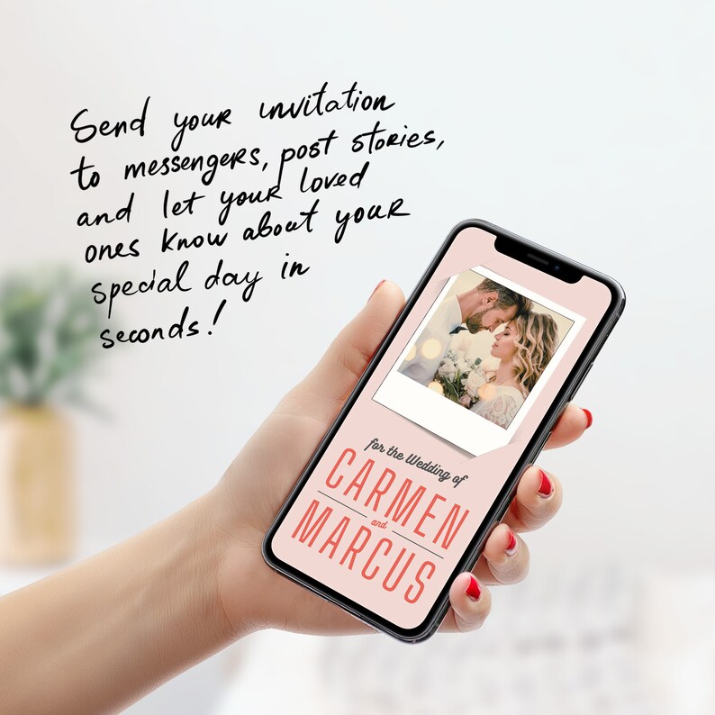 May include: A pink and white smartphone screen displays a wedding invitation for Carmen and Marcus. The invitation features a photo of a couple in a Polaroid frame. The text on the screen reads "for the Wedding of Carmen and Marcus".