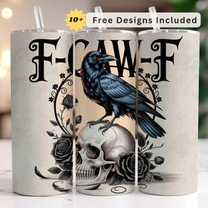 May include: A stainless steel tumbler with a black raven perched on a skull, surrounded by black roses and foliage. The design includes the text "F-CAW-F" in black. The tumbler has a straw and the text "10+ Free Designs Included".