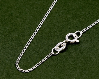 May include: A silver chain necklace with a lobster clasp fastening.