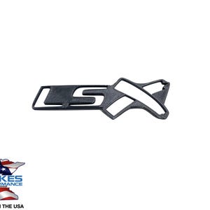 May include: Black LSX emblem with a textured surface. The emblem is a stylized design with the letters "LS" and an "X" shape. The logo for Wilkes Performance Auto Garage is in the lower left corner, with "Made in the USA" below it.