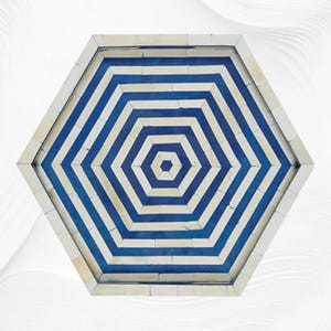 May include: A hexagonal tray with a geometric pattern. The tray has alternating blue and off-white stripes that fan out from the centre. The outer edge is a solid off-white colour, forming a border. This decorative tray is suitable for serving or display.