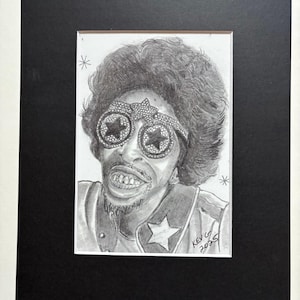 May include: A pencil sketch portrait of a person wearing star-shaped glasses and a star-adorned headband. The artwork is signed "Kev G 2023" and matted in black, with the text "Art by Kev G" at the bottom.