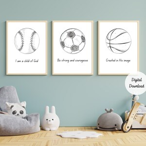 May include: Three printable wall art prints with black and white illustrations of a baseball, soccer ball, and basketball. Each print has a different inspirational quote: "I am a child of God", "Be strong and courageous", and "Created in His image".