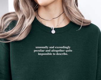 May include: A dark green sweatshirt with the text "unusually and exceedingly peculiar and altogether quite impossible to describe." printed on the front.