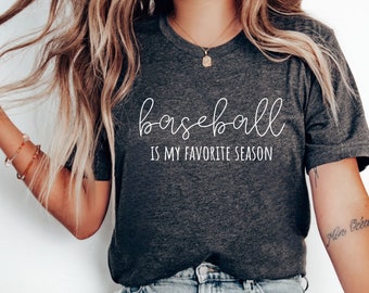 May include: A dark gray t-shirt with the text "baseball is my favorite season" in white script font.