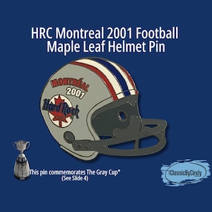 May include: A Hard Rock Cafe pin featuring a gray football helmet with red and blue stripes, and the text "Montreal 2001". The pin commemorates The Gray Cup. The background is a dark blue.