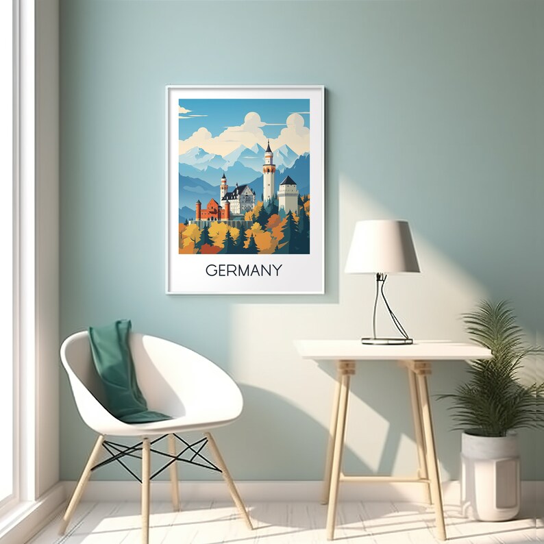 May include: A white framed print of a colorful illustration of Neuschwanstein Castle in Germany. The castle is surrounded by trees and mountains. The text "GERMANY" is printed below the illustration.