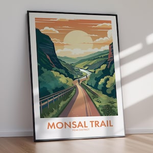 May include: A framed art print featuring a stylised landscape of the Monsal Trail in the Peak District. The illustration depicts a path winding through green hills and cliffs under a large sun, with the text MONSAL TRAIL PEAK DISTRICT below.