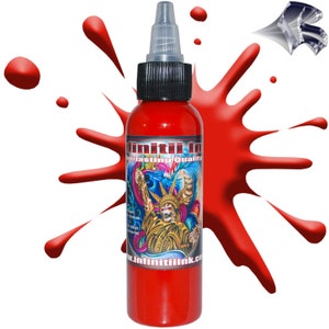 May include: A red bottle of tattoo ink with a label that says "Infiniti Ink Everlasting Quality" and a website address. The bottle is sitting on a white background with a red splatter behind it.