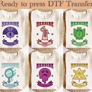 May include: Six cream-coloured t-shirts with various designs. Each shirt displays the word "HEXSIDE" above a graphic and a banner with a coven name: Oracle, Bard, Plant, Illusion, Abomination, and Emperor's. The text "Ready to press DTF Transfer" is at the top.