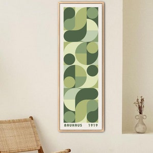 May include: A vertical abstract art print with geometric shapes in shades of green and yellow. The print has the text "BAUHAUS 1919" at the bottom.