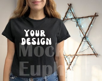 May include: A black t-shirt with the text "YOUR DESIGN" in white, featuring a casual fit and short sleeves.