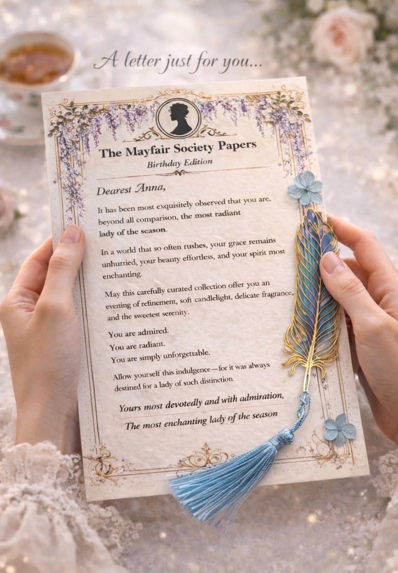 Romantic vintage personalised letter card held in hands with elegant blue feather bookmark, regency inspired gift message insert for luxury spa gift box, feminine aesthetic self care present.