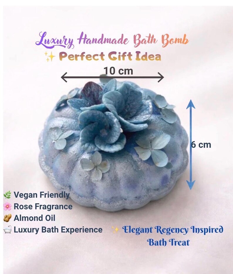 Large handmade blue floral bath bomb with hydrangea decoration showing size 10 cm by 6 cm, vegan friendly bath bomb with rose fragrance and almond oil.